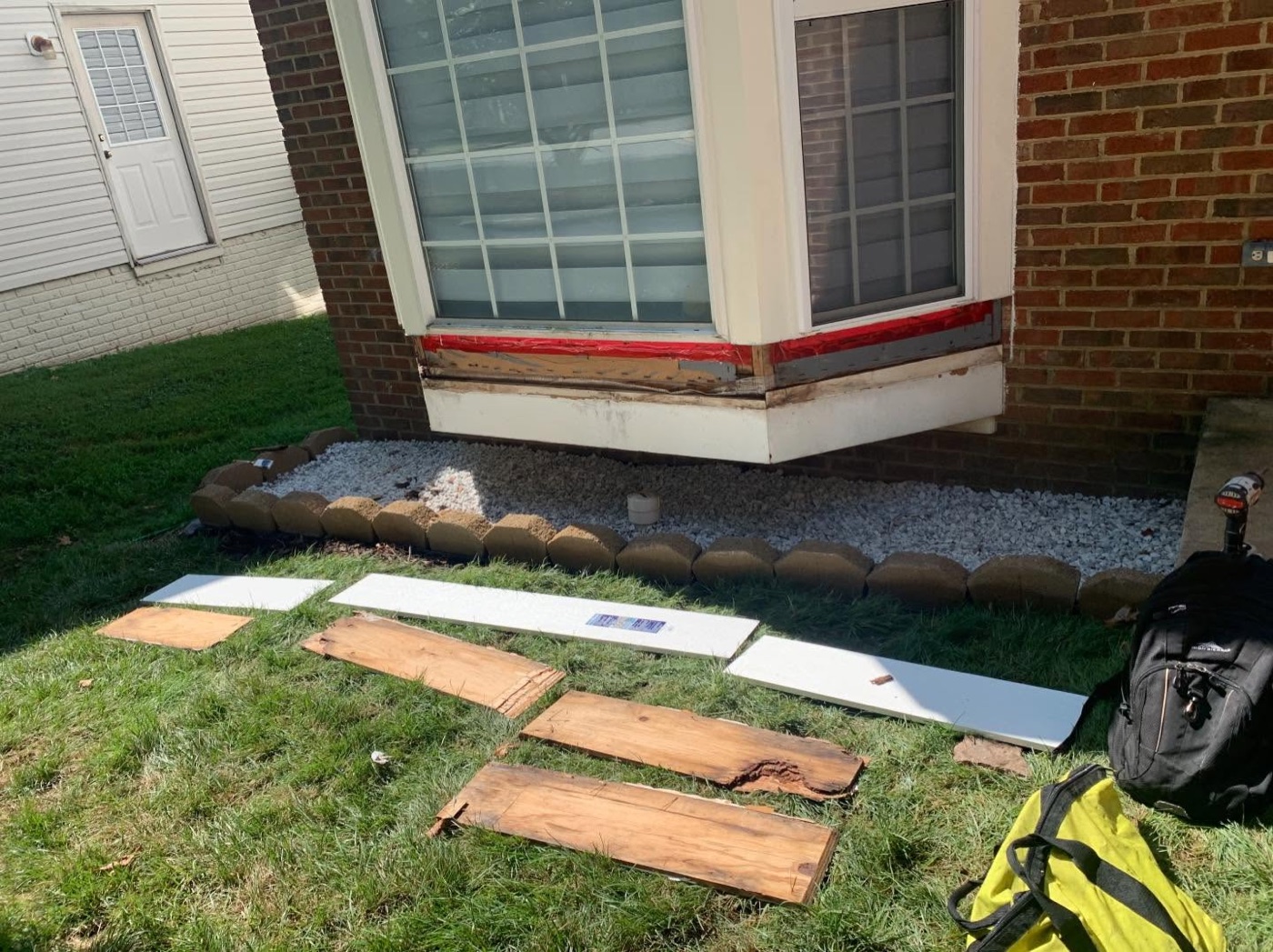 Bay window stripped showing water damage before repair