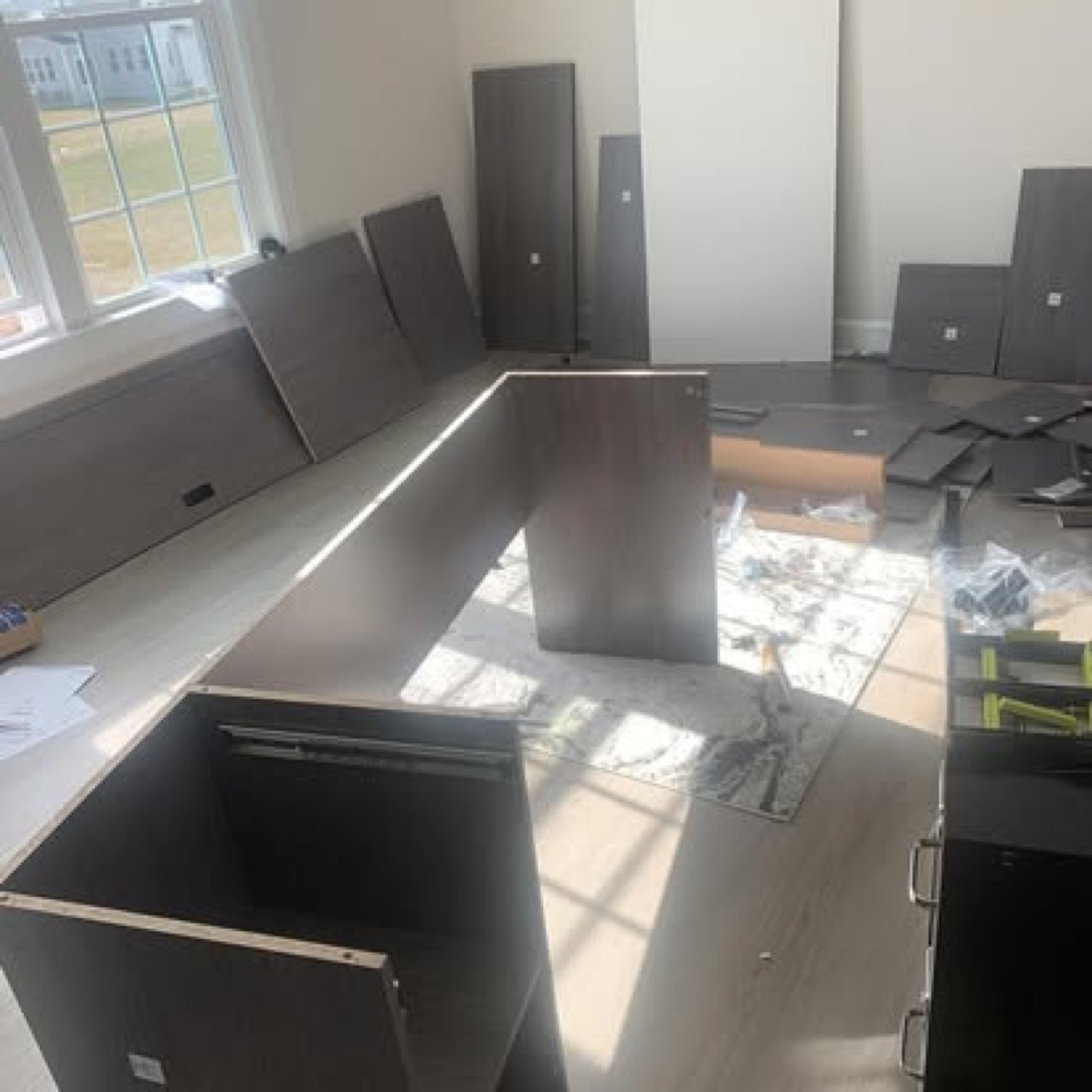 Desk parts laid out mid-assembly