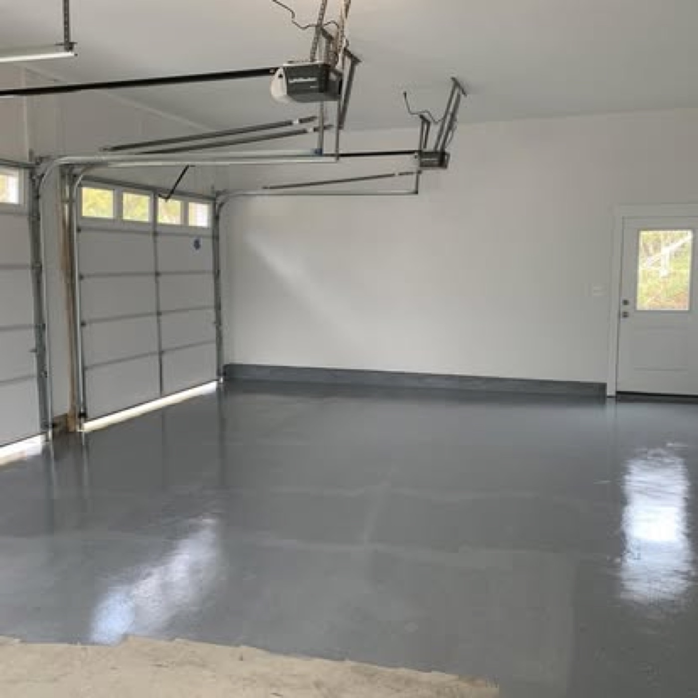 Garage with fresh glossy gray epoxy floor